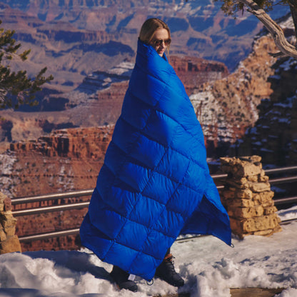 Photo of a woman wearing the down blanket at the Grand Canyon